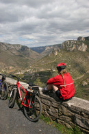 06-3049 Female Mountain Biker Enjoying the View into the Gorge Du Tarn, Cevennes National Park, France